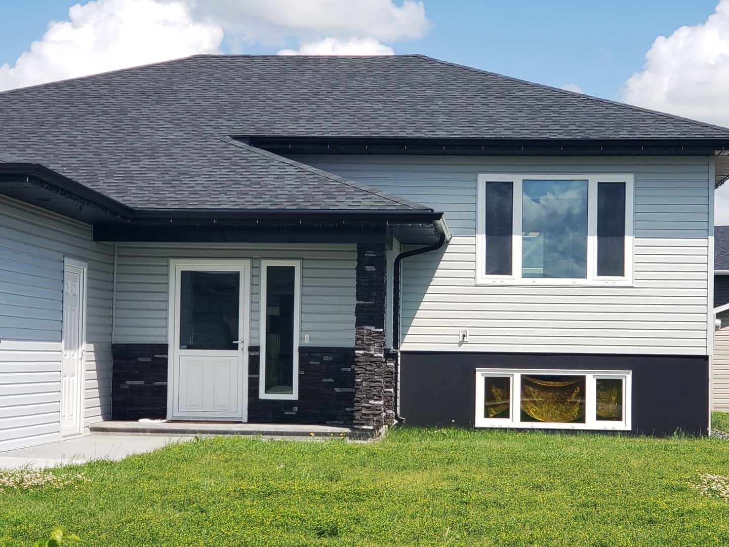 Tilt turn windows in a light grey house